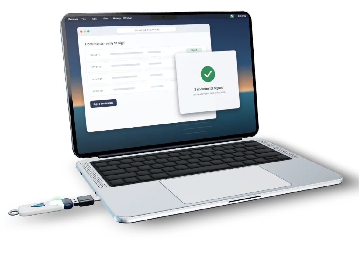 A MacBook with a USB token plugged into its side through a small USB-C adapter. On screen, the ETA Signer window asks to sign 3 documents requested by invoicing.eta.gov.eg, then shows them signed.